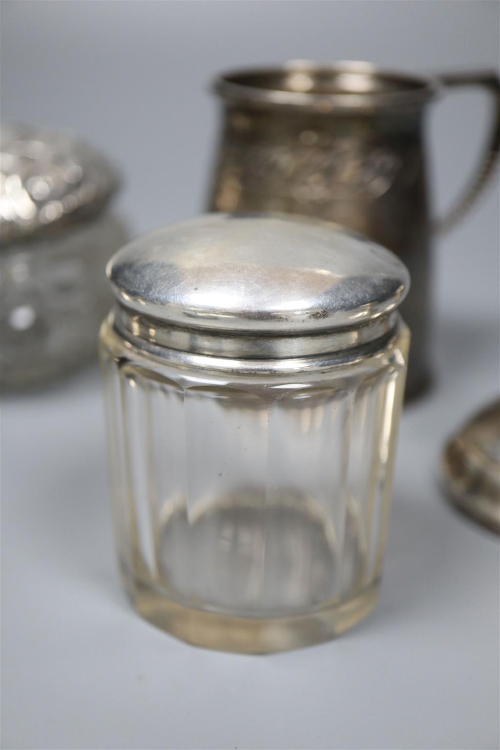 A silver Christening mug, a pair of silver seal top spoons and sundry silver,